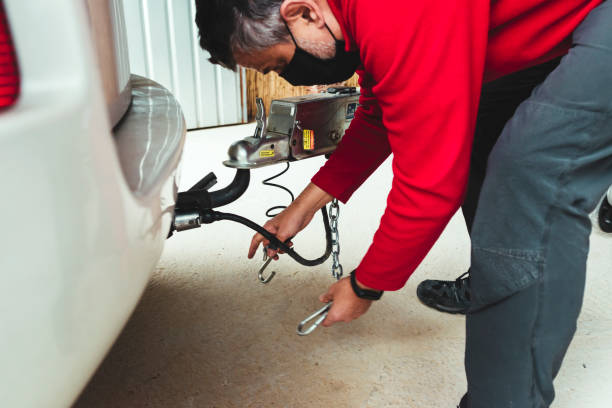 istock Technician is installing aluminum boat head,Aluminum plated boat trailer hitch isolated 1288798633