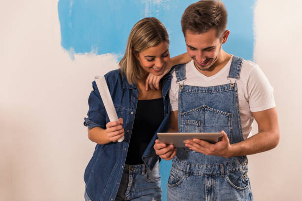 istock Couple looking for inspiration when planning home renovation 1288799669