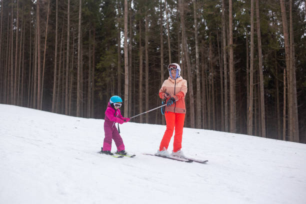 istock The child is skiing with his mother. 1288800039