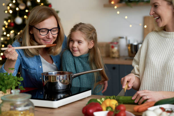 istock Three women in kitchen preparing Christmas food 1288801204