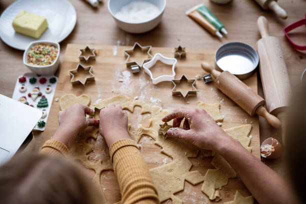 istock Top view of hands preparing Christmas cookies 1288802594