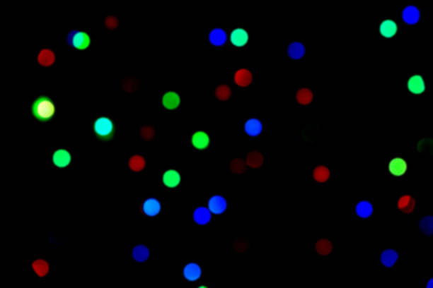 istock Blur colorful bokeh in black backdrop 1288802893