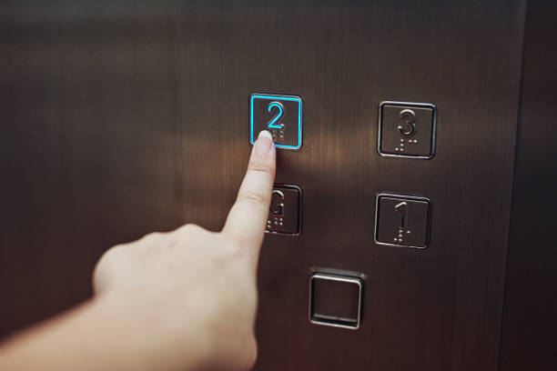 New heights here I come Cropped shot of a woman pressing a button in an elevator number 2 photos stock pictures, royalty-free photos & images