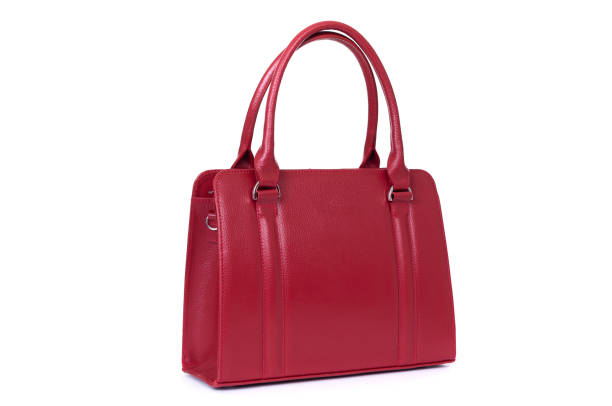 istock red leather hand made bag on a white background 1288804684