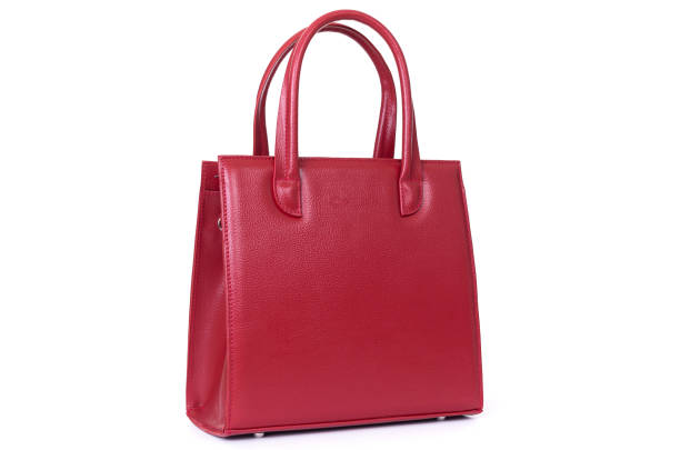 istock red leather hand made bag on a white background 1288804713