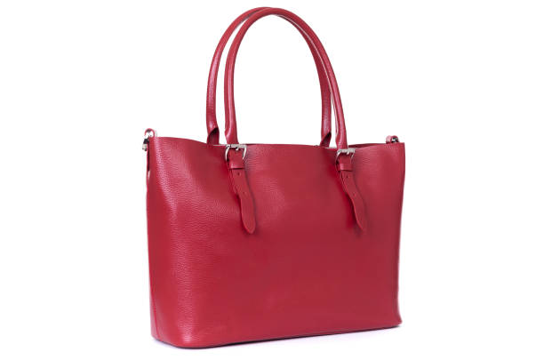 istock red leather hand made bag on a white background 1288804781