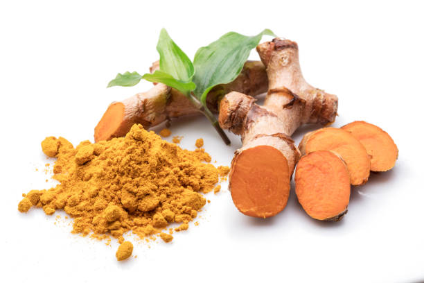 istock Fresh turmeric rhizome and turmeric powder isolated on white background. 1288805497