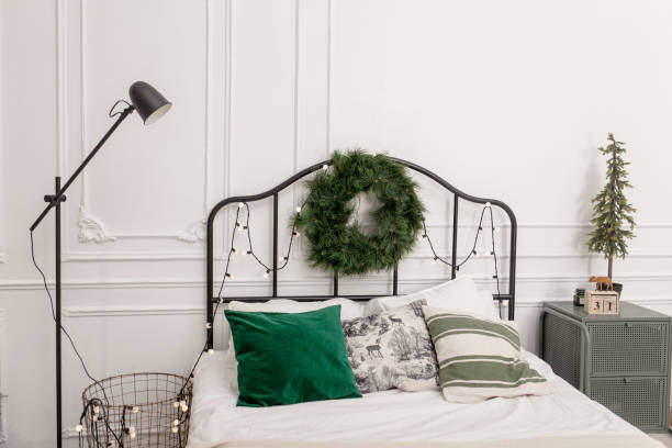 istock Bedroom interior with bed decorated Christmas tree 1288806440
