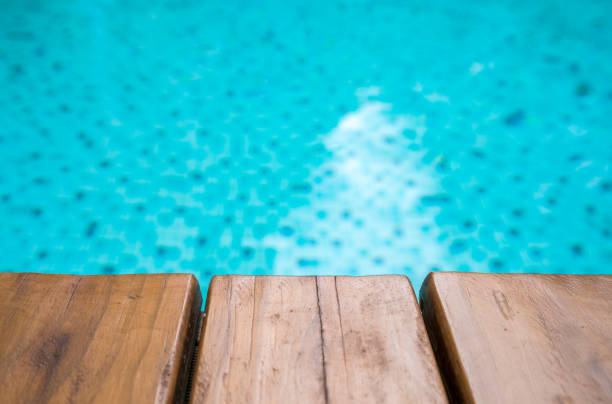 istock Empty Wooden board on the pool for background 1288807791