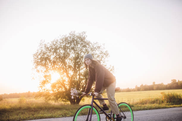 istock Young woman riding with bicycle 1288808378