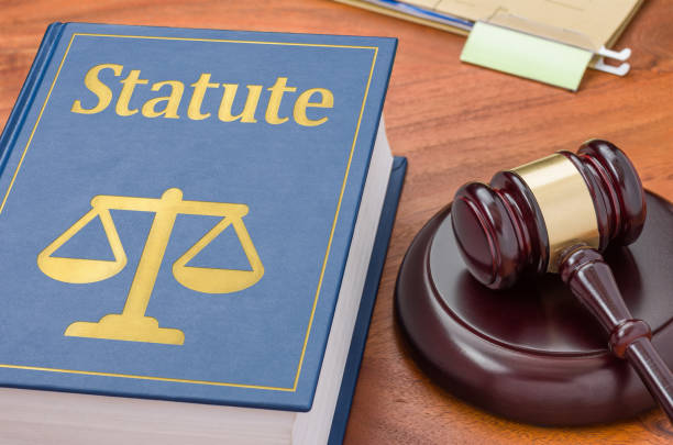 istock Law book with a gavel - Statute 1288809157