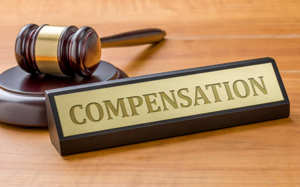 istock A gavel and a name plate with the engraving Compensation 1288809224