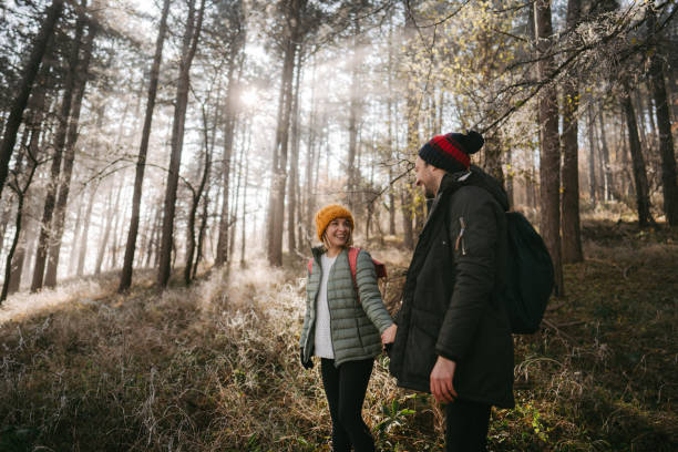 istock Young couple hiking on a cold winter day 1288810540
