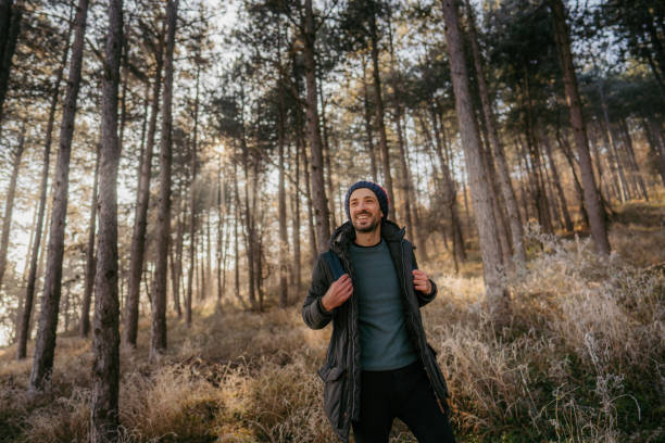 Young man hiking on a cold winter day