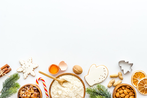 Christmas cooking background with gingerbread cookies, overhead view, flat lay.
