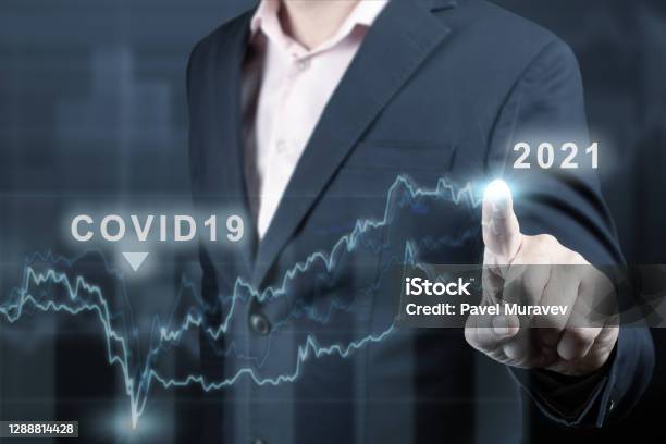 Concept Of Economic Recovery After The Fall Due To The Covid 19 Coronavirus Pandemic Financial Graph 2021 Stock Market Chart Businessman Pointing Graph Return Of Growth After A Fall Stock Photo - Download Image Now