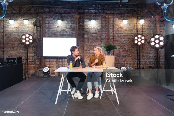 Young Adult People During Discussion In Desing Studio Stock Photo - Download Image Now