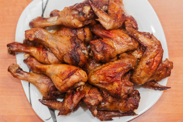 istock fried chicken wings and chicken drumsticks 1288817079