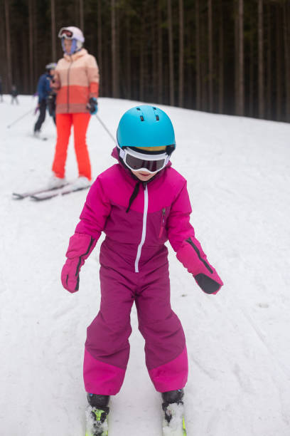 istock The child is skiing with his mother. 1288818377