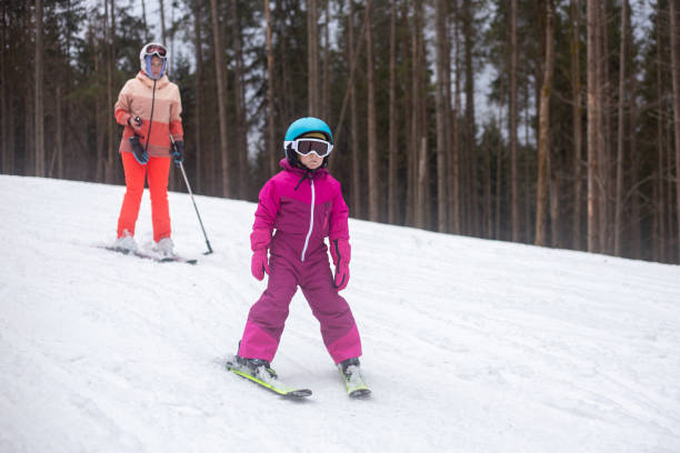 istock The child is skiing with his mother. 1288819491