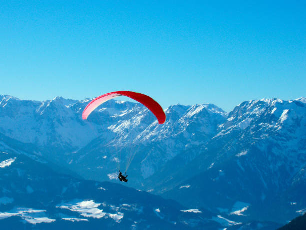 istock paraglider in the alps in winter 1288820224