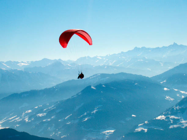 istock paraglider in the alps in winter 1288820236
