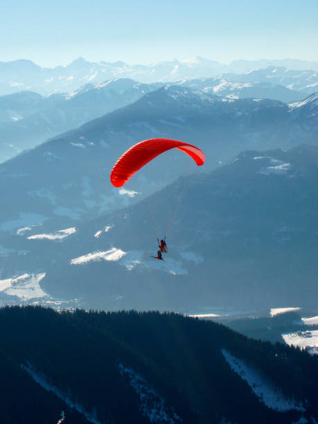 istock paraglider in the alps in winter 1288820244