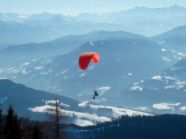 istock paraglider in the alps in winter 1288820277