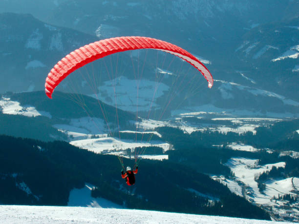 istock paraglider in the alps in winter 1288820291