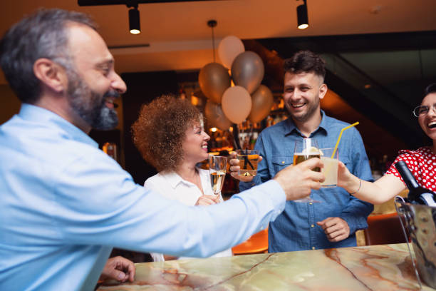 istock Small group of friends toasting at bar 1288821145