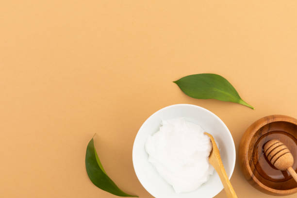 istock Bowls with yoghurt and dressing on yellow background 1288822639