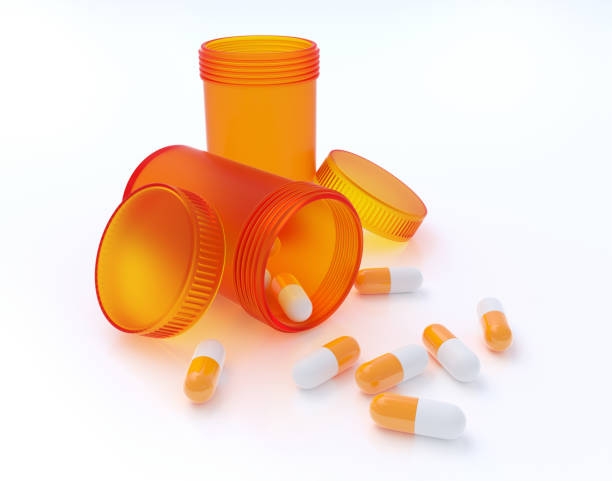 istock Orange pill bottles with pills 1288823304