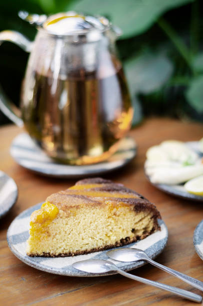 istock organic mango cake and herbal tea set on rustic cafe table outdoors 1288824584