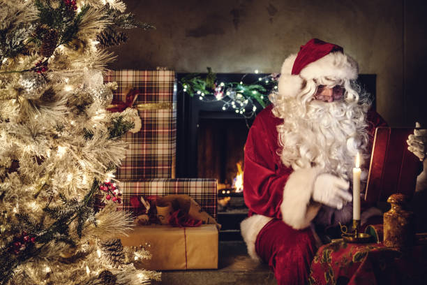 istock Santa claus doing video call 1288827135