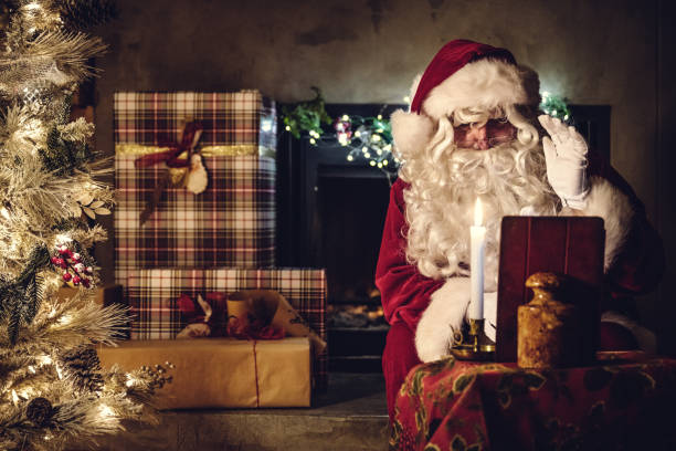 istock Santa claus doing video call 1288827160