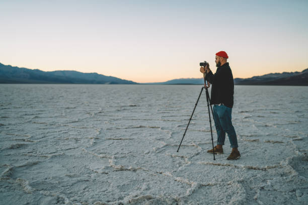 istock Focused man taking picture of nature 1288828435