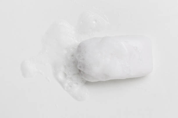 istock Soap bar and foam on white background, top view. Mockup for design 1288828746