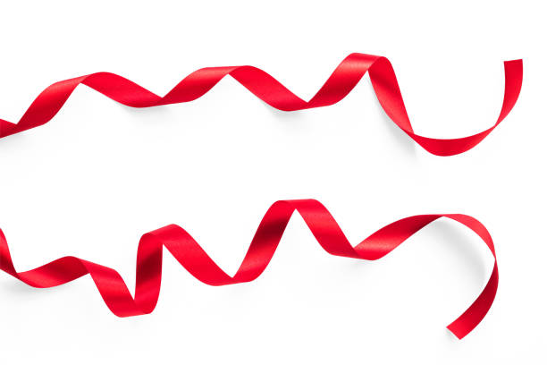 istock Red satin bow ribbon scroll set isolated on white background with clipping path for Christmas holiday and wedding card design decoration element 1288829395