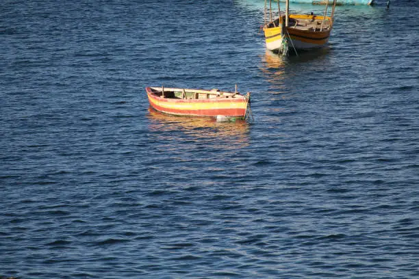 Photo of Old fishing boat floating on the water