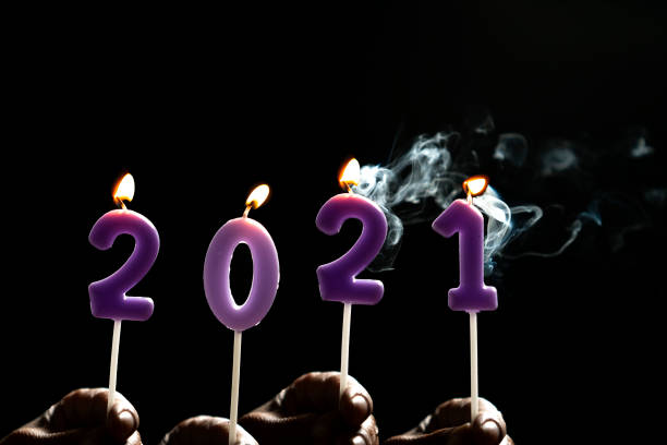istock Number Candle 2021 New year ideas On a black background 1288830271