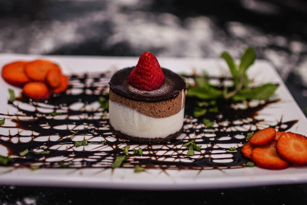 istock Cake with strawberry on the top and chocolate dressing 1288830846