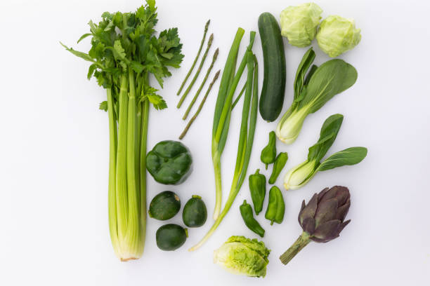 istock Celery, cucumber, lettuce and peppers on white background 1288831528