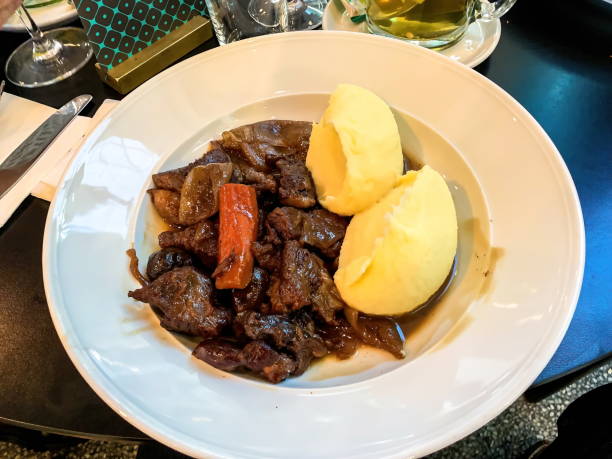 istock Beef stew served with mashed potatoes and carrotson white plate, 4K 1288833277