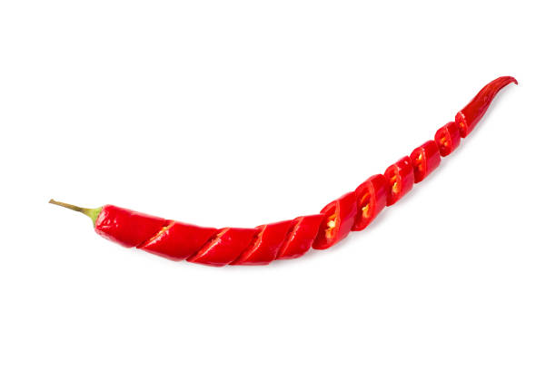 Sliced hot chili pepper isolated on white background. Clipping path included