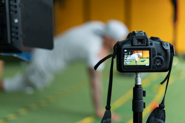 istock Close-up of the camera that records the coach doing push-ups 1288835381
