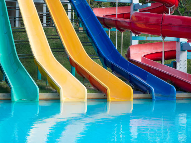 istock Colorful plastic water-slide in swimming pool. 1288836024