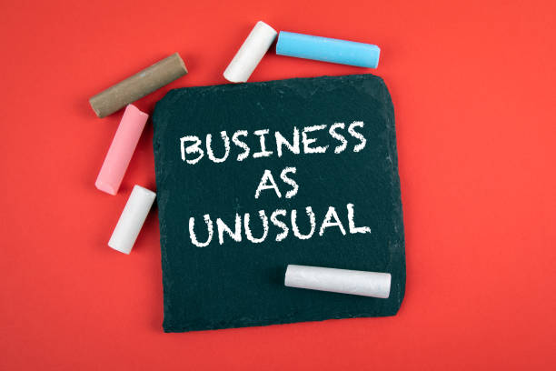 istock Business as unusual. Text on a stone surface 1288838591