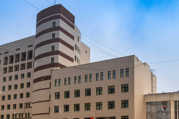 istock Urban architecture, an unusual building with a tower against the sky. 1288838638