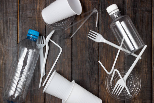 istock Plastic waste, bottles, glasses, trash. Nature pollution. 1288840943