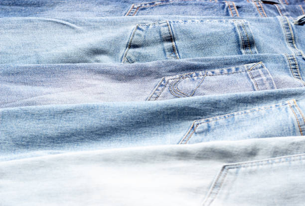 istock Denim texture. Texture of ripped light blue jeans. 1288841030